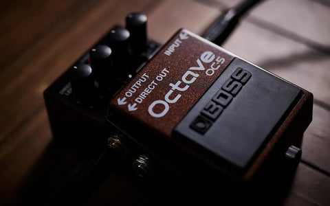 Octave Pedal OC-5 For Guitar And Bass With Mono And Poly Modes on wooden surface, dry direct output visible.