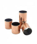 Ten Pack Of SF1 Self Lubricating Bushings 20Mm X 15Mm Oilless Sleeves stacked, showcasing copper and black material for heavy machinery use.