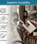 Keyed Alike Padlock Set For Heavy Duty Security 4 Pack with hand holding stainless steel shackle on weathered gate