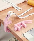 2 Pack Pink Zipper Jig Tool For Zipper Pulls Plastic Zip Slider Installing Tool Adjustable Handy Zip Fastener Jig For Dresses Pants Jackets 5.2 To 6.2 Inches Long shown on a table with zipper supplies