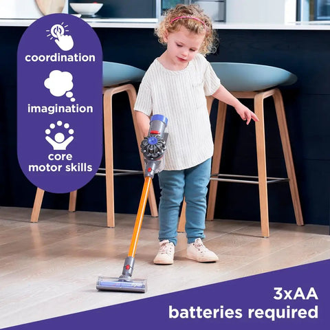 Child using Officially Licensed Interactive Cordless Vacuum Toy For Kids, Realistic Role Play Cleaner with short nozzle indoors.