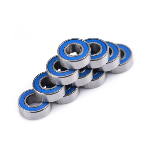 Flanged 5x11x4mm deep groove ball bearing 2RS steel with double shield seals stacked in a pile for rail track linear motion systems