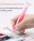 Hand holding pink Handmade Resin Diamond Painting Pen Kit With Glue Clay And Multiple Tips, Faster And More Comfortable, 5D Diamond Painting Tools For DIYers, Pink Essentials, working on 5D diamond art