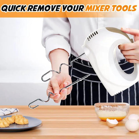 Top Shelf 5 Speed Electric Hand Mixer With Five Heavy Duty Stainless Steel Whisks And A Workhorse 120 Watt Motor For Killing It On Every Bake And Piping Smooth Frosting No Sweat In Classic White, showing easy whisk removal.