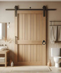 Bathroom setup with wooden sliding door featuring Dual Motion Matte Black Sliding Barn Door Pull Handles 3-3/4 Inch