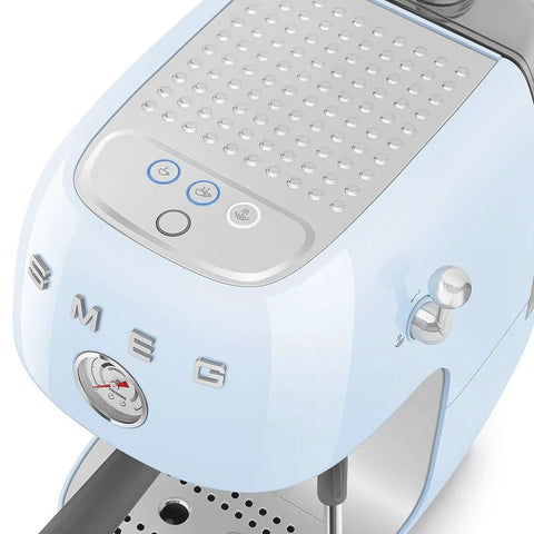 Close-up of the Totally Iconic Retro Espresso Maker With Cold Brew Feature in pastel blue, showcasing buttons and gauge.