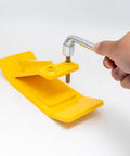 Heavy Duty Tractor Bucket Skids For Lawns And Driveway Surfaces Two Pack Bolt On Edge Guards with yellow wear plates and wrench in use.