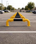 Built Like A Tank Full Weld Steel Driveway Guard And Warehouse Safety Barrier With U Shaped Floor Mount Design Using Thickened Reinforced Pipes That Handle Heavy Traffic Like A Boss Protect Your Garage Space Without Worries Ever, yellow and black steel barrier in parking lot.