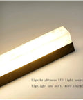 Modern LED Wall Sconce Dropping Chill Ambient Glow With 3000K Up And Down Illumination Top Shelf Build for bedroom with soft lighting.