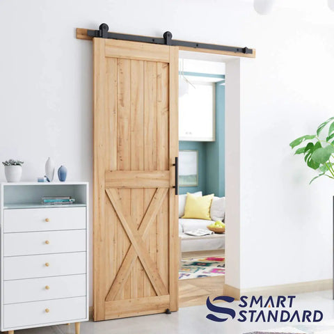 Top Mount Sliding Barn Door Hardware Kit For 6 Ft Doors complete set installed with wooden panel, visible in modern living room.