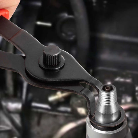 Close-up of Snap Ring Pliers Set 10 Piece Kit For Internal And External Retaining Rings showing application on machinery
