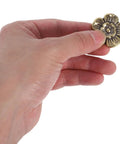 Hand holding a floral decorative handle from Antique Brass Cabinet Knobs 2 Pack Floral Drawer Pulls Decorative Handles For Kitchen Cabinets Wardrobes And Furniture Replacement Hardware With Solid Brass Construction And A Classic Retro Vibe