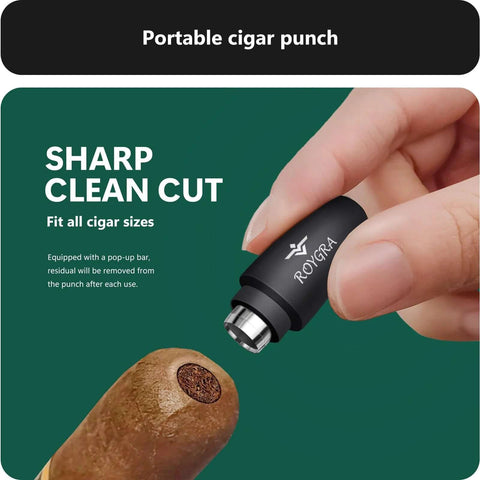 Cigar punch tool by ROYGRA, stainless steel with black housing, close-up used on a cigar.