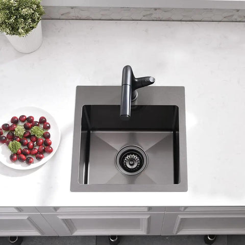 Top view of 15 Inch Drop In Bar Sink With A Deep Bowl In 16 Gauge T304 Stainless Steel For Small Kitchens Or Wet Bars Top Mount Noise Reduction Outdoor RV Ready Includes Grid And Strainer in modern kitchen setting, highlighting spacious design and stainless steel finish.