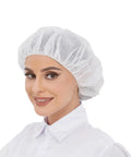 Person wearing Disposable Bouffant Hair Net for Food Service and Beauty, Latex Free, 24 Inch Cap, Pack of 100, White.