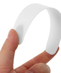 Ten Pack Plastic Collar Stays With White Tips For Mens Dress Shirts And Suits Durable Collar Supports shown on a hand.