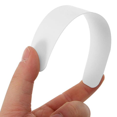 Ten Pack Plastic Collar Stays With White Tips For Mens Dress Shirts And Suits Durable Collar Supports shown on a hand.
