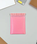 Pink Bubble Padded Mailers Self Seal Envelopes 100 Pack For Jewelry And Makeup Supplies Waterproof Shipping Bags shown open