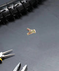 Secure Your Wheels With These 2 Pack M10 Wheel Lug Bolts Metal Studs Heavy Duty Replacement Hub Screws on workbench with tools.