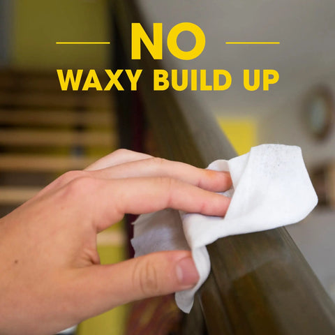 Hand using Expert Care Wood Wipes With Lemon Scent For Quick Shine And Protection Of Sealed Wood, wiping wooden railing.
