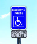 Heavy Duty Aluminum Handicap Parking Sign Ada Compliant Reflective Metal Plaque mounted on a pole against a blue sky.