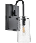 Close-up of single matte black fixture with seeded glass shade from Three Light Vanity Light Fixture In Matte Black With Seeded Glass Shades For Bathroom, Industrial Retro Wall Mount Over Mirror, Hardwired Three Bulb Vanity Fixture For Dope Warm Glow And Soft Illumination