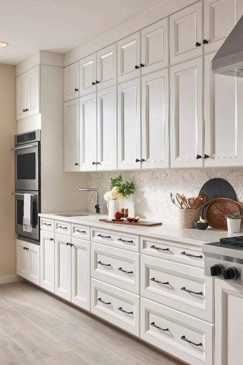 Modern kitchen cabinets with Grace Collection Riverside Pull Honey Bronze Six And Five Sixteenths Inch Center To Center handles.