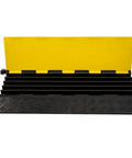 Open view of Beefy 5 Channel Cable Ramp Protector For Driveway And Outdoor Use showing 5 channels with yellow cover and black base.