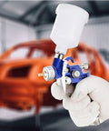 Pro Level Mini Hvlp Paint Sprayer With Gravity Feed Cup And Genuine Stainless Steel 1.0Mm Nozzle, handheld in use for detailing.