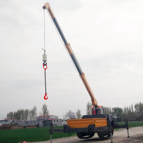Dual-hook lifting chain sling with red hooks hanging from a blue/orange telescoping crane boom on a mobile crane truck.
