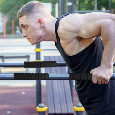 Man using Three Pack Pull Up Bar Grip Sleeves With Anti Slip Sponge Pads for non skid hand guards on horizontal bars outdoors
