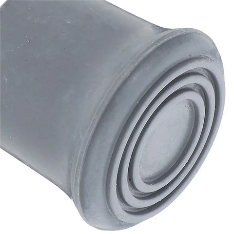 Close-up of a rubber foot cap from Non Slip Shower Chair Feet Replacement Kit 8 Pack Durable Rubber Foot Caps For Bath Stools And Benches Easy Slip On Fit Protect Floors Stabilize Seating And Comfort For Walking Aids showing circular grooves.
