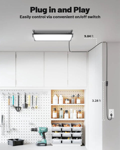 Four Pack Linkable LED Shop Lights With Built In Outlet 100W 15000LM Aluminum Garage Lighting installed in workshop ceiling.