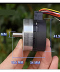 Side view of Brushless Servo Motor 12V DC With Built In Drive And PWM Speed Control, 100 Line Encoder held in hand, showing dimensions.