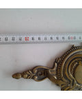 Close-up of Robust Vintage Brass Wall Hook with Classic Old School Charm and Tough Build for Entryway or Bathroom Decor.