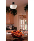 Cambridge 1-Light Semi Flush Ceiling Fixture In Blackened Oil Rubbed Bronze installed in cozy kitchen, white glass shade