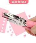 Heart And Star One Quarter Inch Metal Handheld Paper Punch Set With Soft Handled Design for crafting star shapes on pink paper.
