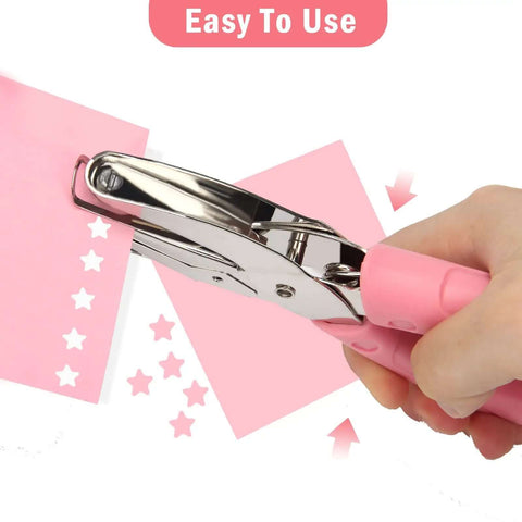 Heart And Star One Quarter Inch Metal Handheld Paper Punch Set With Soft Handled Design for crafting star shapes on pink paper.