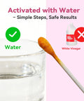 Front view: AssuTest lead test kit: glass of water with green check; white vinegar with red X beside a test swab.