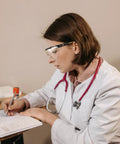 Kick Up Dust Without Fogging Out These Safety Glasses Fit Seamless Over Your Specs Scratch Proof Lenses Ansi Certified Gear in use by a woman writing.
