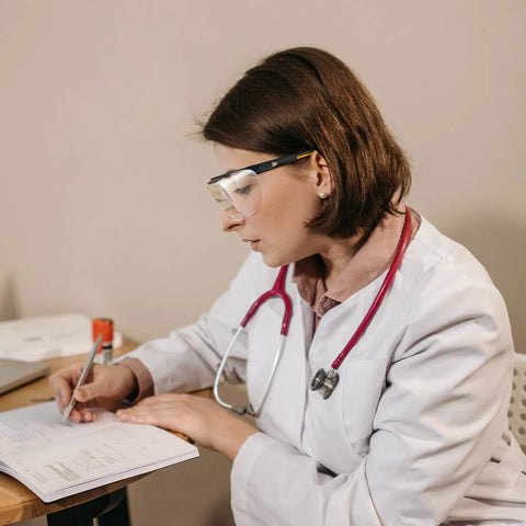 Kick Up Dust Without Fogging Out These Safety Glasses Fit Seamless Over Your Specs Scratch Proof Lenses Ansi Certified Gear in use by a woman writing.