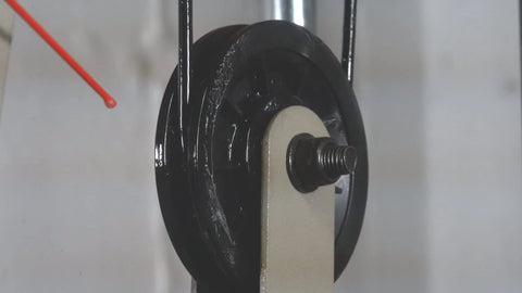 Silicone Lubricant With Teflon Fluoro Polymer For Non Metal Materials applied on a rotating wheel to reduce friction and sticking