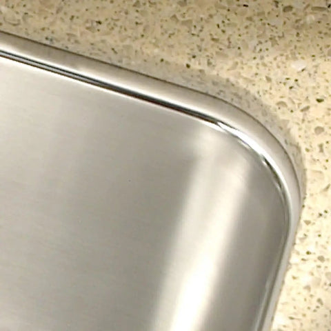 Corner detail of Medallion Gourmet Series Undermount Stainless Steel Kitchen Sink with Large Single Bowl Satin Finish