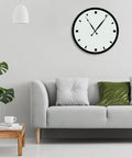 Wall clock with high torque silent DIY wall clock movement kit, two quartz movements, and 8 inch long hands above modern sofa.