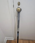 Heavy Duty Door Security Bar With One Ton Strength installed on inward-opening door, adjustable aluminum jammer for security.