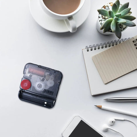 12888 Clock Replacement Movements No-Hassle Easy Installation Swing Mute Movement on desk with coffee and notebook