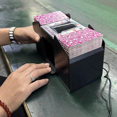 User operating 4 Deck Automatic Card Shuffler with Plug In and Battery Power for Home Poker Nights on green table