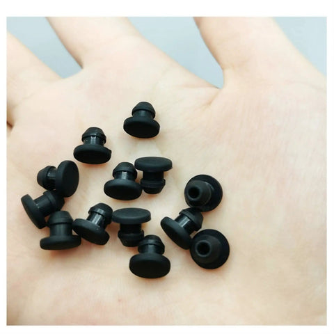 Silicone Rubber Snap-On Plugs And Hole Caps With High O-Ring Assortment Kit For Industrial Piping, Automotive Systems, And Food Processing Sealing, Built To Stand Up To Tough Temp Ranges From Minus Forty To Plus Two Hundred Fifty Degrees C. black silicone plugs shown in hand