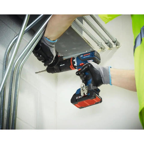 18V Brushless Hammer Drill Driver With Optional Bluetooth Connectivity Module in use drilling into a metal surface