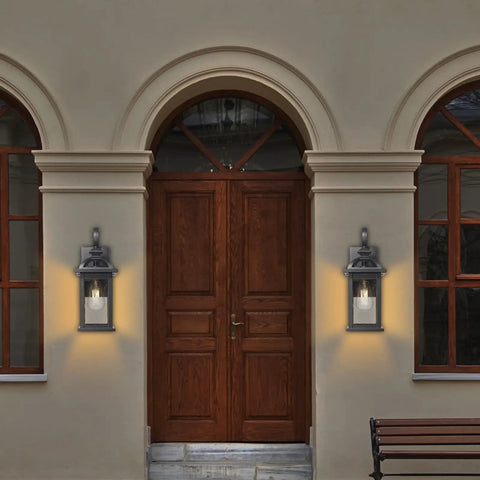 Outdoor Wall Light Sconce With Seeded Glass Weatherproof Aluminum Exterior Fixture by a wooden door on a porch